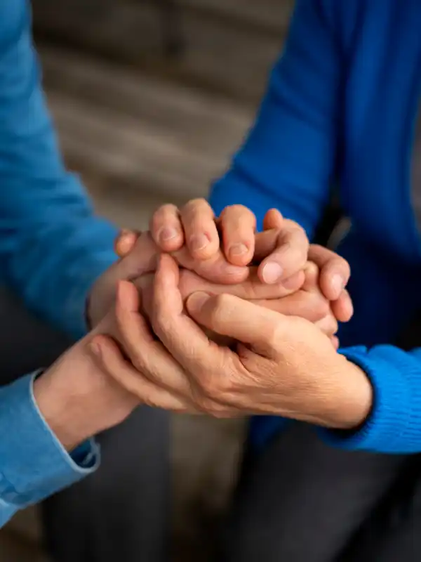 people holding hand in support